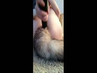 Tight bottom teen uses huge black dildo for pussy insertion while butt plug is inserted in her ass
